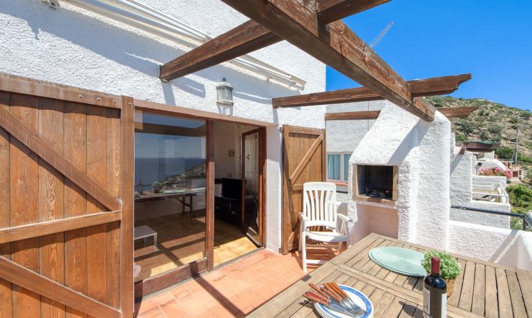 Charming Townhouse with Sea Views and Community Pool in Canyelles